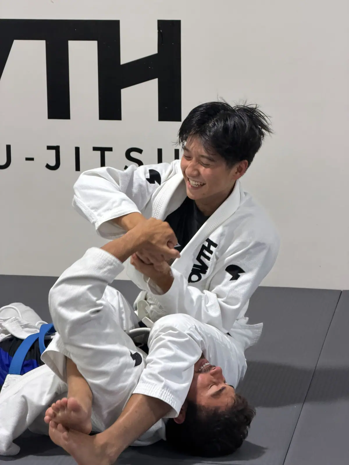 A student laughing during a Gi class