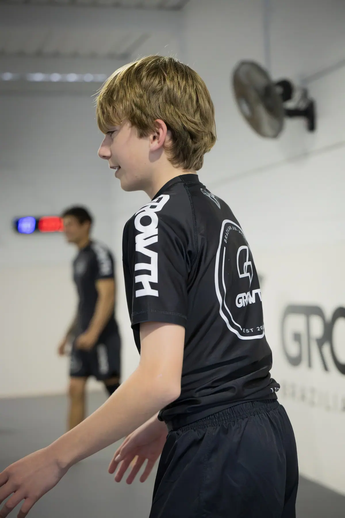 A teenage student smiling between rounds