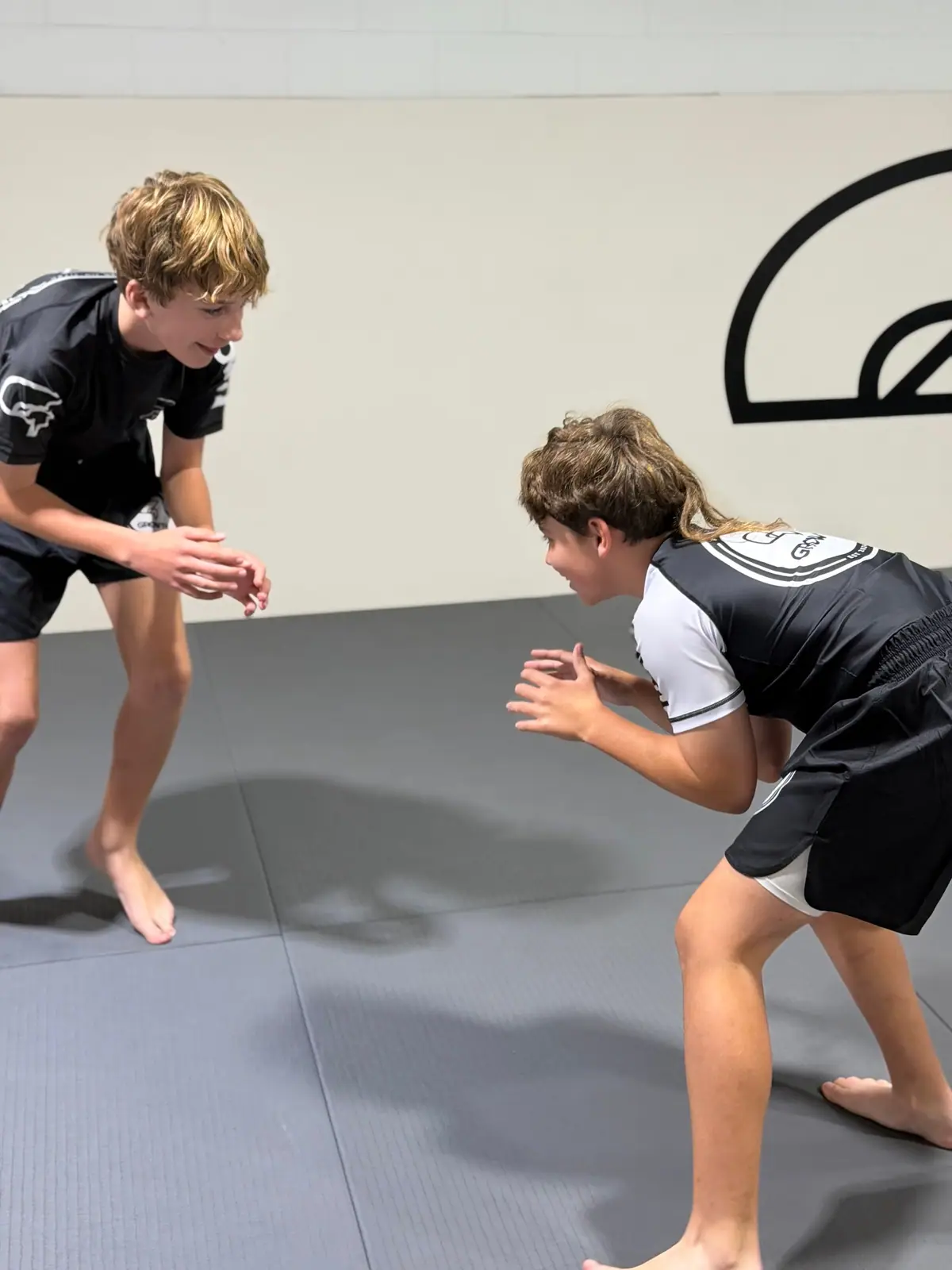 Two teens squaring up in a No-Gi class